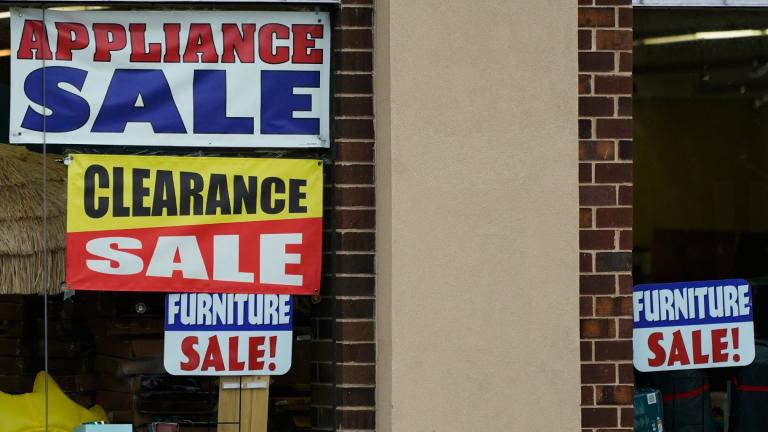Sale signs are displayed at an appliance store in Arlington Heights, Ill., Nov. 8, 2023. (AP Photo / Nam Y. Huh)