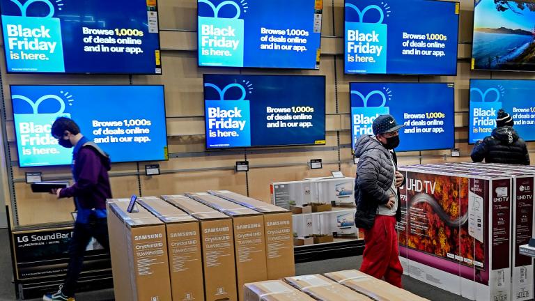 People look at televisions during a Black Friday sale at a Best Buy store on Friday, Nov. 26, 2021, in Overland Park, Kan. (AP Photo / Charlie Riedel, File)