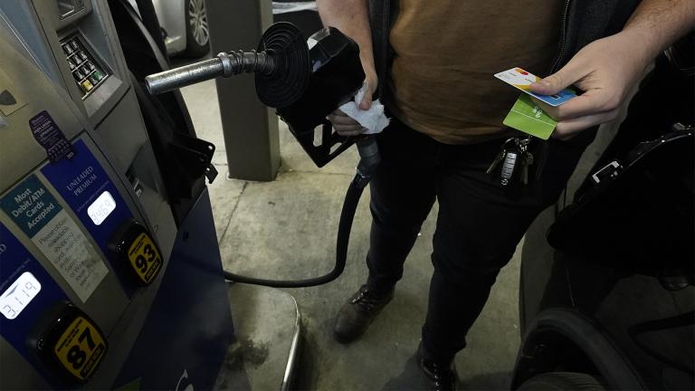 A customer prepares to pump gasoline into his car at a Sam’s Club fuel island in Gulfport, Miss., Feb. 19, 2022. (AP Photo / Rogelio V. Solis)
