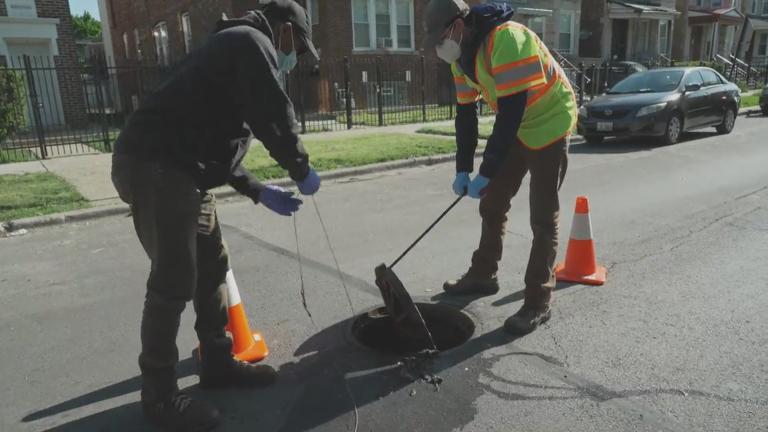 Workers test sewage as part of a COVID-19 tracking effort. (Credit: University of Illinois Discovery Partners Institute)