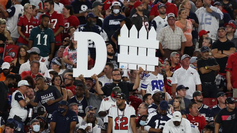 A Tampa Bay Buccaneers fan holds a sign during the first half of an NFL football game against the Dallas Cowboys Thursday, Sept. 9, 2021, in Tampa, Fla. (AP Photo / Mark LoMoglio)
