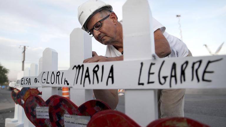 In this Aug. 5, 2019, file photo Greg Zanis of Aurora prepares crosses to place at a makeshift memorial for victims of a mass shooting at a shopping complex in El Paso, Texas. (AP Photo / John Locher, File)