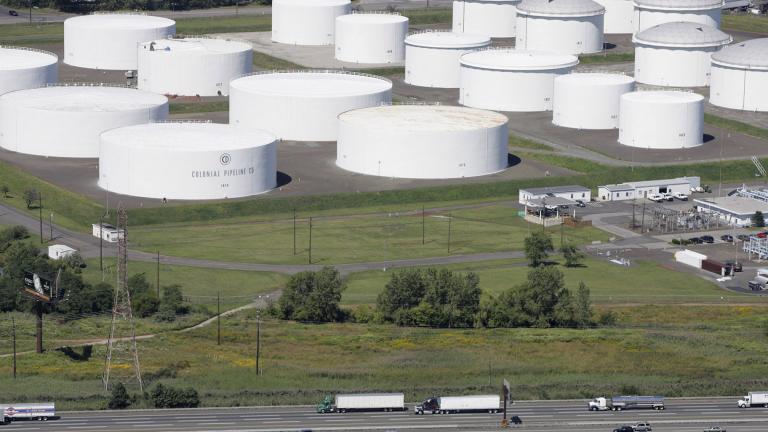 In this Sept. 8, 2008 file photo traffic on I-95 passes oil storage tanks owned by the Colonial Pipeline Company in Linden, N.J. (AP Photo / Mark Lennihan, File)