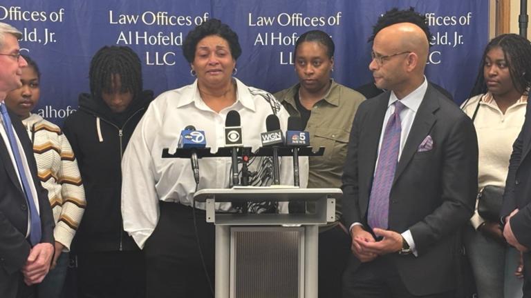 Surrounded by her family and her attorneys, Cynthia Eason chokes back tears as she discusses the $5.7 million verdict in the lawsuit her family filed against the city over a 2018 botched raid. (Heather Cherone / WTTW News)