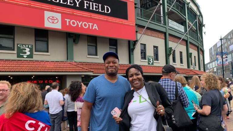 Curtis Wilson from Aurora, left, and Natalie Goodman from Lombard attend a DNC volunteer appreciation rally at Wrigley Field on Aug. 15, 2024. (Eunice Alpasan / WTTW News)