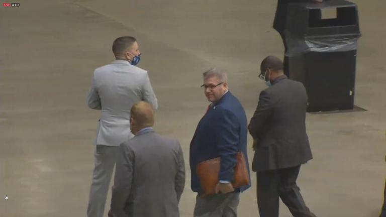 State Sen. Darren Bailey is escorted out of a May 2020 Illinois Senate session for not wearing a mask. (WTTW News)