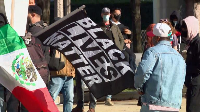 A group of approximately 100 protesters gathered near the Cloud Gate sculpture in Millennium Park to protest police brutality on April 13, 2021. (WTTW News)