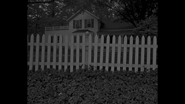 Dawoud Bey. “Untitled #1 (Picket Fence and Farmhouse),” from the series “Night Coming Tenderly, Black,” 2017. Rennie Collection, Vancouver. © Dawoud Bey.