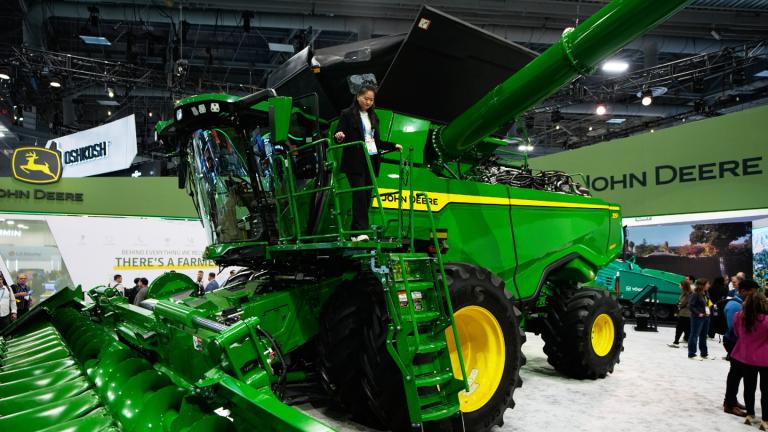 A person walks on an X9 1100 combine at the John Deere booth during the CES tech show, Jan. 6, 2026, in Las Vegas. (AP Photo / John Locher, File)