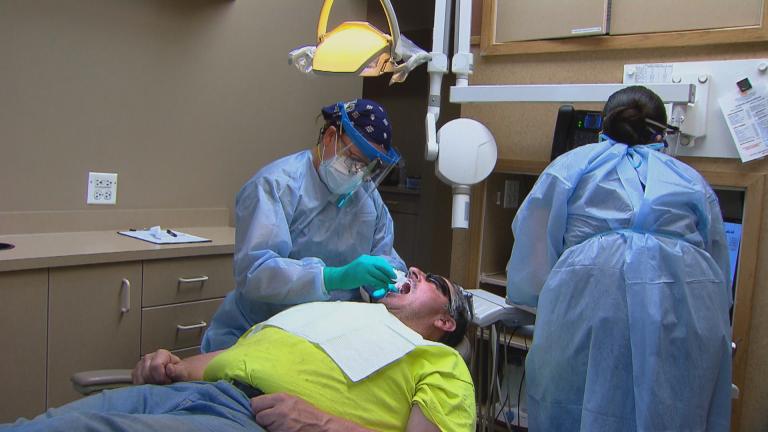 Dentists are wearing more personal protective equipment in the COVID-19 era. (WTTW News)