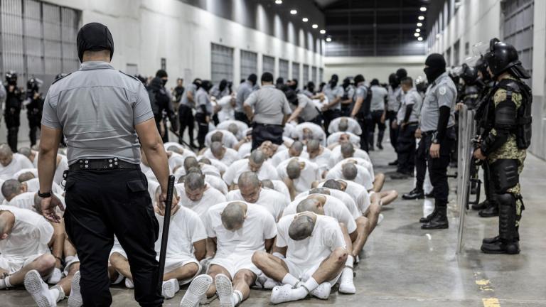  In this photo provided by El Salvador's presidential press office, a prison guard transfers deportees from the U.S. to the Terrorism Confinement Center in Tecoluca, El Salvador, March 16, 2025. (El Salvador presidential press office via AP, File)