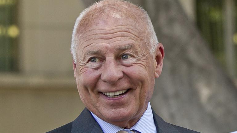 Attorney Tom Girardi smiles outside the Los Angeles courthouse on Wednesday, July 9, 2014. (AP Photo / Damian Dovarganes, File)