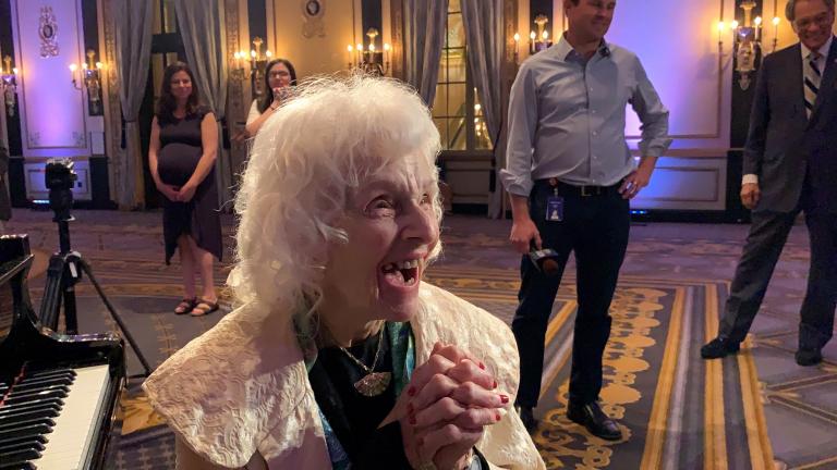 Pianist Dorothy Olson Pauletti reacts to receiving a lifetime achievement award from the Chicago Federation of Musicians.