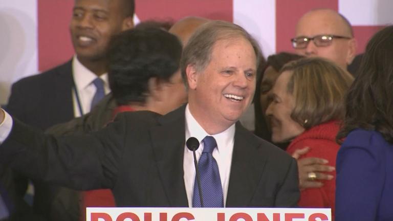 Doug Jones celebrates his victory over Roy Moore on Dec. 12.