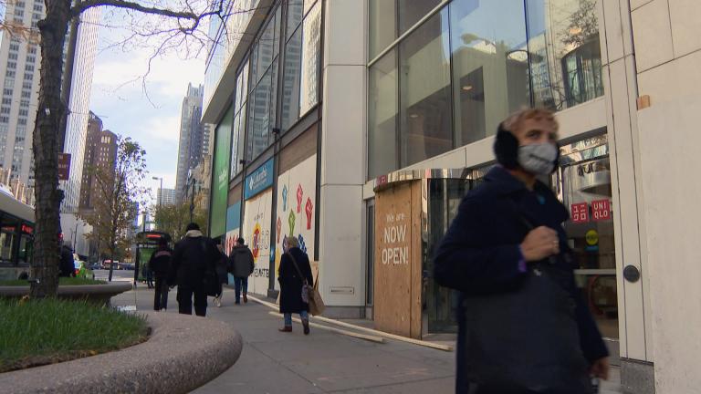 Downtown Chicago businesses brace for possible election-related unrest by boarding up their windows on Monday, Nov. 2, 2020. Election week also saw record numbers of new COVID-19 cases in Illinois. (WTTW News)