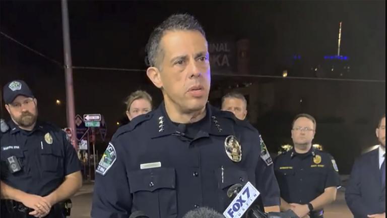 This photo provided by Austin Police Department shows Chief Chacon providing an update on overnight shootings in Austin, Texas, early Saturday, June 12, 2021. Chacon says gunfire erupted in a busy entertainment district downtown early Saturday injuring several. (Austin Police Department via AP)