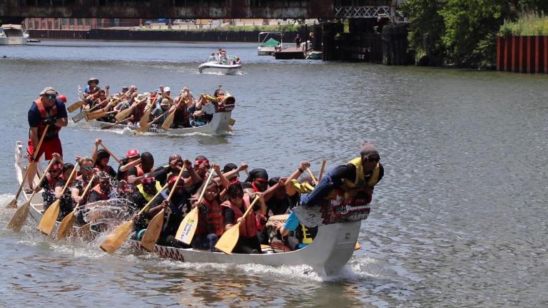 Team UCAN, a North Lawndale-based nonprofit, used the chant “UCAN!” (or “You can!”) to paddle in sync with each other. (Evan Garcia / WTTW)