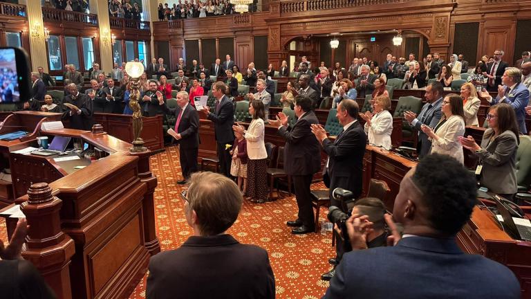 Members of the Illinois General Assembly applaud U.S. Sen. Dick Durbin on May 27, 2026. (Nick Blumberg / WTTW News)