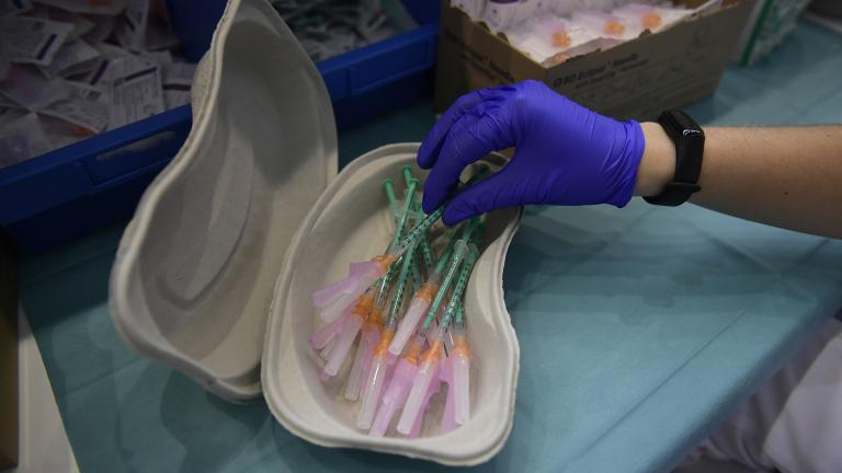 In this Thursday, Sept. 2, 2021 file photo, a health worker prepares Pfizer vaccines during the national COVID-19 vaccination campaign in Pamplona, northern Spain. (AP Photo / Alvaro Barrientos, File)
