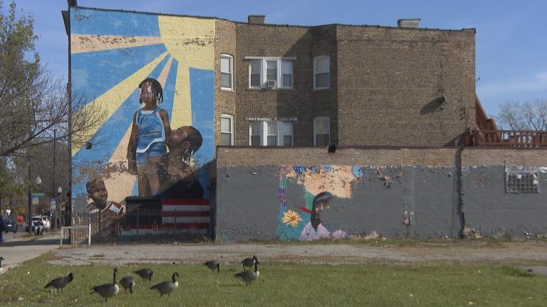 A mural on the side of a building in East Garfield Park. (WTTW News)