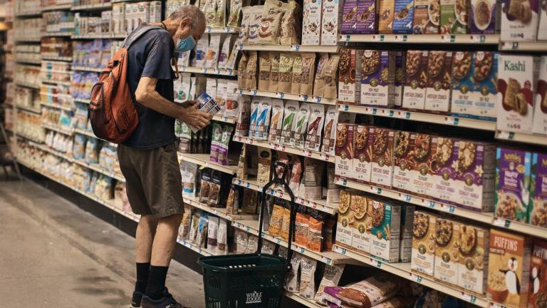 A man shops at a supermarket on Wednesday, July 27, 2022, in New York. (AP Photo  /Andres Kudacki)