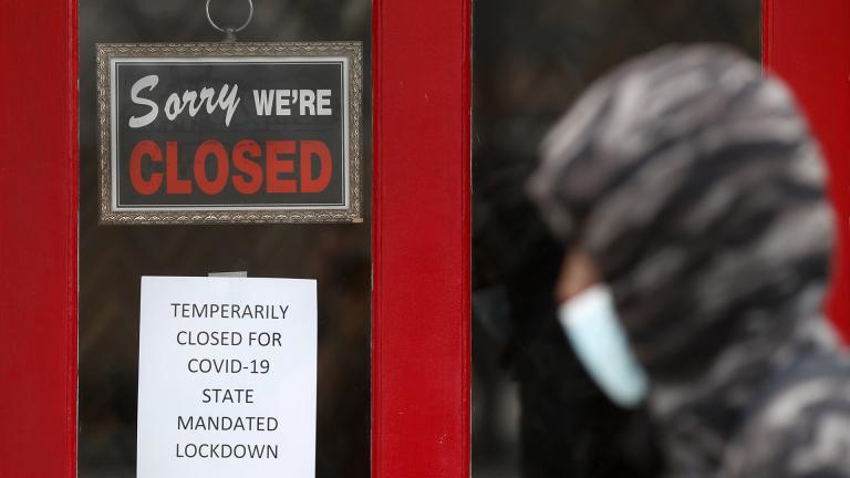 In this May 7, 2020, file photo, a pedestrian walks by The Framing Gallery, closed due to the COVID-19 pandemic, in Grosse Pointe, Michigan. (AP Photo / Paul Sancya, File) In this May 7, 2020, file photo, a pedestrian walks by The Framing Gallery, closed due to the COVID-19 pandemic, in Grosse Pointe, Michigan. (AP Photo / Paul Sancya, File)