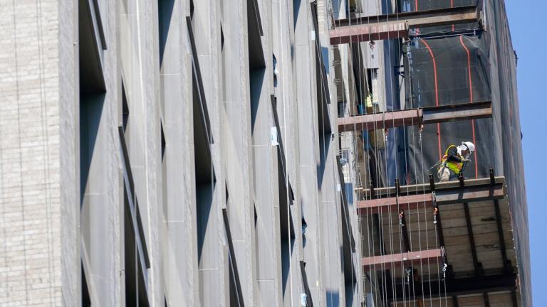 Construction workers is seen working on a high rise residential and commercial building under construction at the Essex Crossing development on the Lower East Side of Manhattan, Thursday, Aug. 4, 2022. (AP Photo / Mary Altaffer)