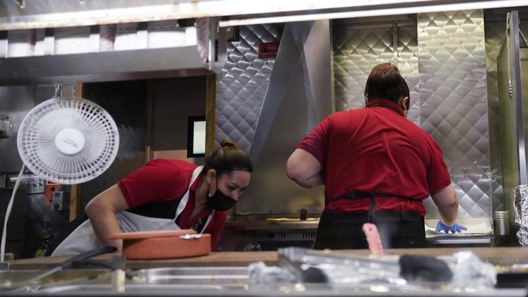 Women work in a restaurant kitchen in Chicago, Thursday, March 23, 2023. On Friday, the U.S. government issues the May jobs report. The labor market has added jobs at a steady clip in the past year, despite efforts by the Federal Reserve to cool the economy and bring down inflation. (AP Photo/Nam Y. Huh, File)