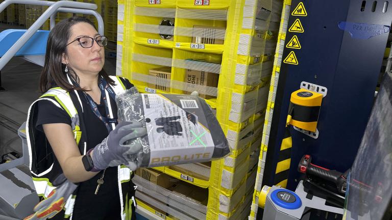 A worker moves a package at an Amazon same-day delivery shipping center in Woodland Park, New Jersey, on Monday, December 18, 2023. On Friday, the U.S. government issues its December jobs report. (AP Photo / Ted Shaffrey)