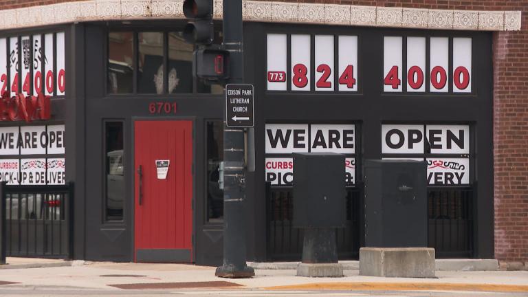A business in Edison Park on Chicago’s Northwest Side tries to catch the attention of passersby during the pandemic. (WTTW News)