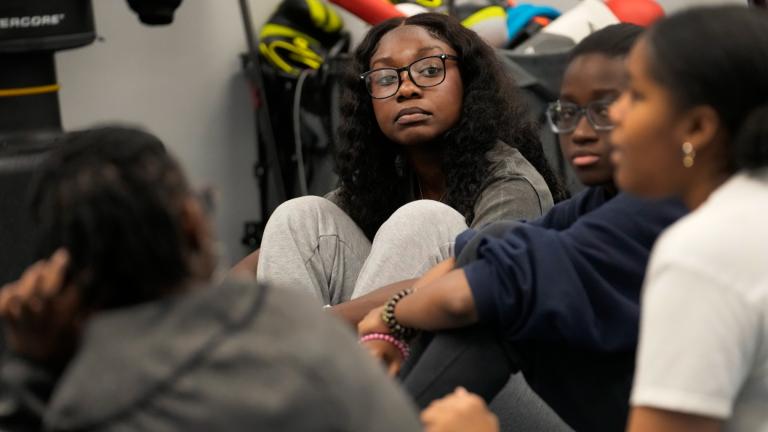 Hillary Amofa listens to others member of the Lincoln Park High School step team after school Friday, March 8, 2024, in Chicago. (Charles Rex Arbogast / AP Photo)