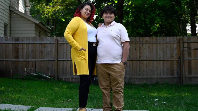 Rousmery Negrón stands with her son at home in Springfield, Mass., on Thursday, Aug. 3, 2023. (Jessica Hill / AP Photo)