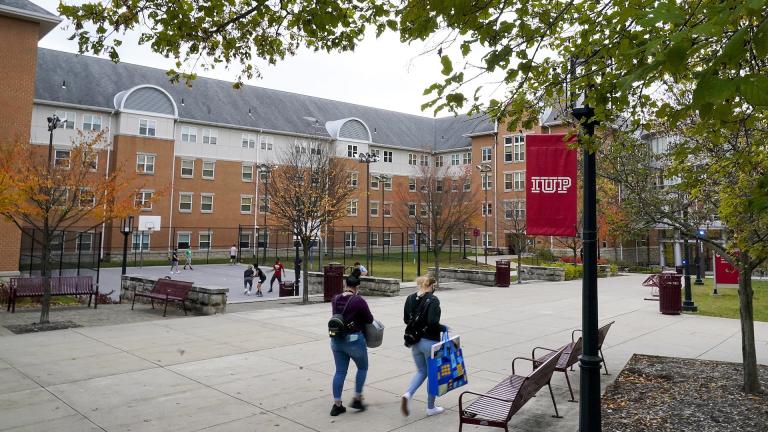 Students walk on the campus of Indiana University of Pennsylvania in Indiana, Pa., Oct. 21, 2020. (AP Photo/Gene J. Puskar, File)