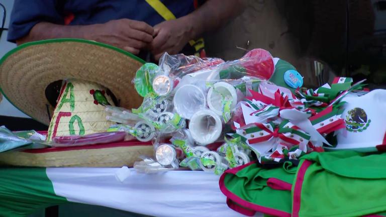 People prepare for an El Grito event in Pilsen on Sept. 15, 2025. (WTTW News)