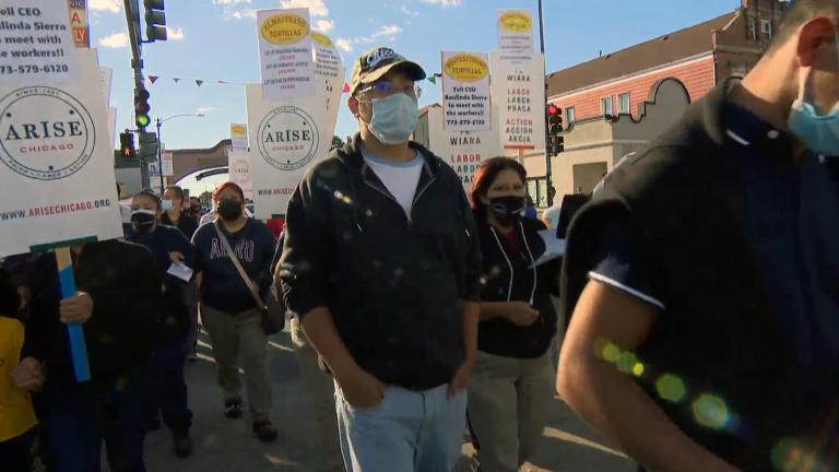 A group of workers with tortilla maker El Milagro march across 26th Street to protest working conditions on Thursday, Sept. 23, 2021. (WTTW News)