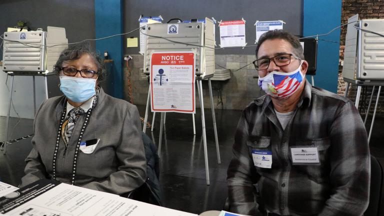 Poll workers Janice Meeks and Marco Rivera at El Mexico Moderno Ballroom in West Humboldt Park on Election Day, Nov. 3, 2020. (Evan Garcia / WTTW News)