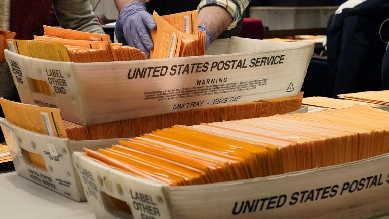 Election officials sort absentee and early voting ballots for counting inside Boston City Hall, Monday, Nov. 2, 2020, in Boston. (AP Photo / Elise Amendola)