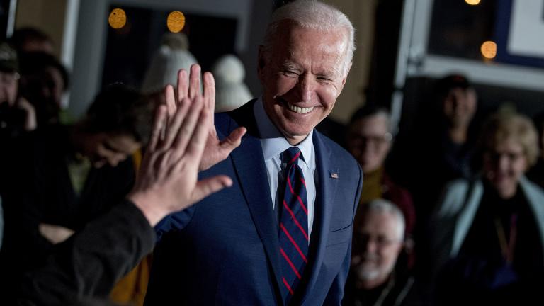In this Jan. 5, 2020, file photo Democratic presidential candidate, former Vice President Joe Biden high-fives a member of the audience during a campaign rally at Modern Woodmen Park in Davenport, Iowa. (AP Photo / Andrew Harnik, File)