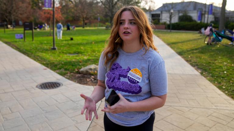 Brianna McCullough, 20, a sophomore at Chatham University in Pittsburgh, walks through campus on Thursday, Nov. 10, 2022. (AP Photo / Gene J. Puskar)