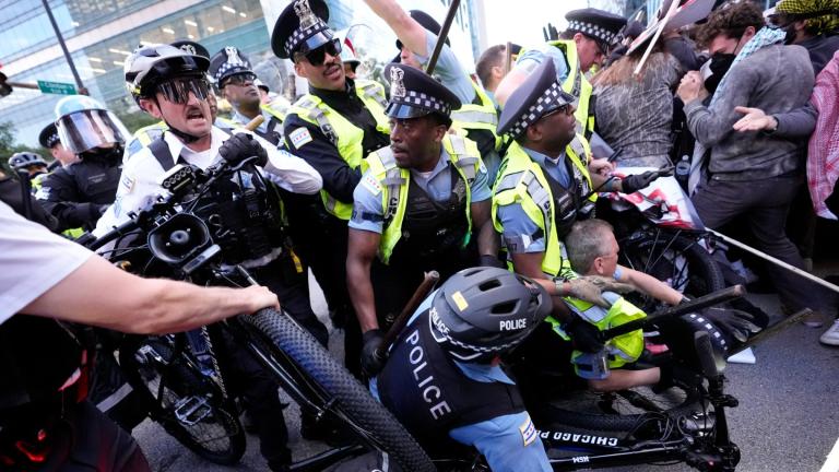 Demonstrators clash with police near the Israeli Consulate during the Democratic National Convention Tuesday, Aug. 20, 2024, in Chicago. (Alex Brandon / AP Photo)