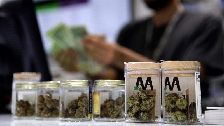 A cashier rings up a marijuana sale, July 1, 2017, at a cannabis dispensary in Las Vegas. (AP Photo/John Locher, File)  A cashier rings up a marijuana sale, July 1, 2017, at a cannabis dispensary in Las Vegas. (AP Photo/John Locher, File)