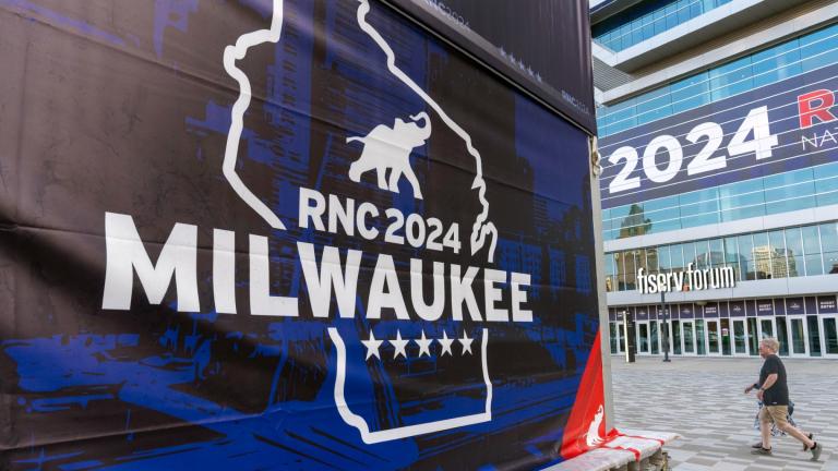 People walk past the Fiserv Forum ahead of the 2024 Republican National Convention, Thursday, July 11, 2024, in Milwaukee. (Alex Brandon / AP Photo)