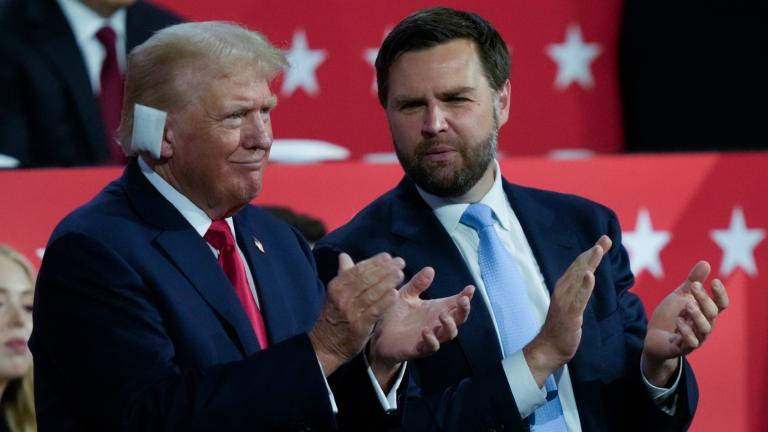 Republican presidential candidate former President Donald Trump and Republican vice presidential candidate Sen. J.D. Vance, R-Ohio, applaud during the Republican National Convention Monday, July 15, 2024, in Milwaukee. (Charles Rex Arbogast / AP Photo)
