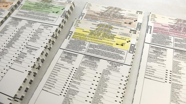 Colored coordinated Presidential Primary Election ballots are organized by political parties for voters on June 7, 2016, at Trinity Lutheran Church in Porterville, Calif. (Chieko Hara / The Porterville Recorder via AP, File)