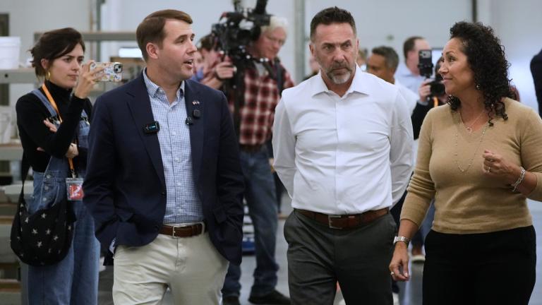 Rep. Chris Pappas, a Democratic candidate for U.S. Senate, left, speaks to Aaron Bagshaw and Adria Bagshaw at the WH Bagshaw company, Tuesday, Sept. 29, 2026, in Salem, N.H. (AP Photo / Robert F. Bukaty)