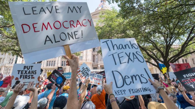 Protestors hold up signs during the Fight The Trump Takeover Rally held at the State Capitol, Saturday, Aug. 16, 2025, in Austin, Texas, to protest congressional redistricting efforts by Texas Republicans and President Donald Trump. (AP Photo / Rodolfo Gonzalez)