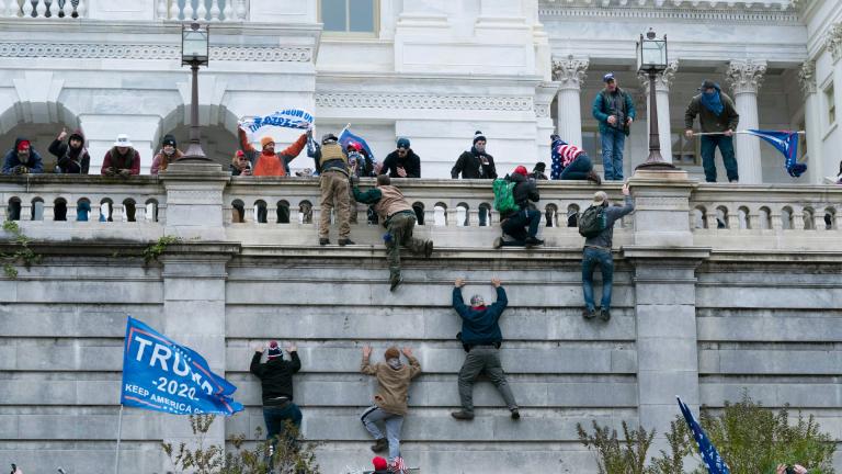 Supporters of President Donald Trump climb the west wall of the U.S. Capitol on Wednesday, Jan. 6, 2021, in Washington. (AP Photo / Jose Luis Magana)