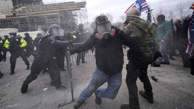 Trump supporters try to break through a police barrier, Wednesday, Jan. 6, 2021, at the Capitol in Washington. (AP Photo / Julio Cortez)