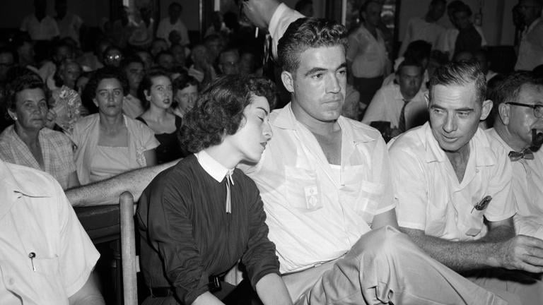 In this Sept. 22. 1955 photo, Carolyn Bryant rests her head on her husband Roy Bryant’s shoulder after she testified in Emmett Till murder court case in Sumner, Miss. (AP Photo, File)