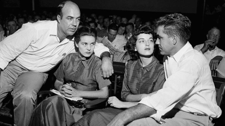 In this Sept. 23, 1955, file photo, J.W. Milam, left, his wife, second from left, Roy Bryant, far right, and his wife, Carolyn Bryant, sit together in a courtroom in Sumner, Miss. (AP Photo, File)